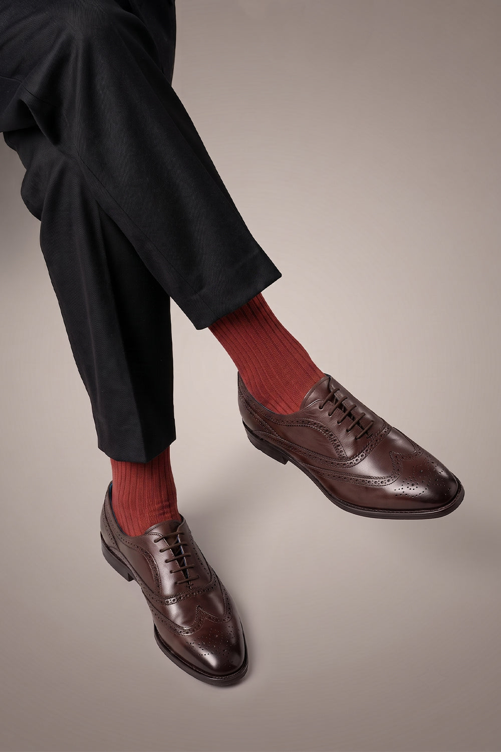 Model wearing Premium solid cotton socks designed by Oswin Hyde for the discerning gentleman.