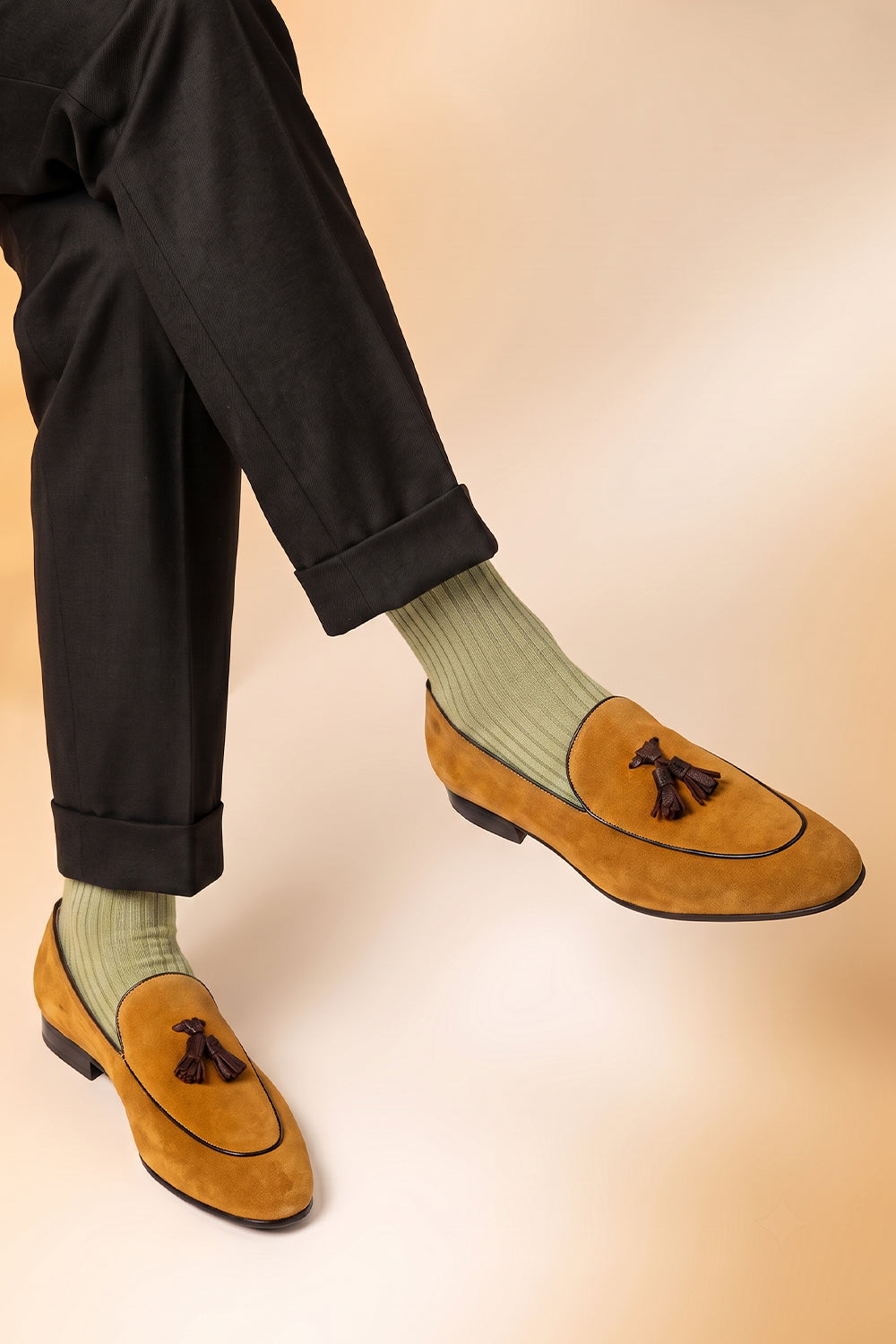 Model wearing Premium solid socks designed by Oswin Hyde for the discerning gentleman.