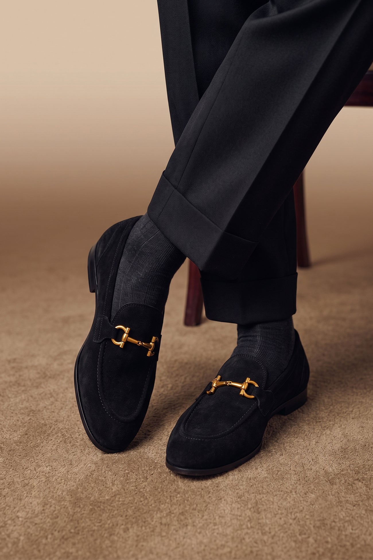 Man wearing Horsebit men's Black Suede Premium Loafers by Oswin Hyde with contemporary design and comfort.