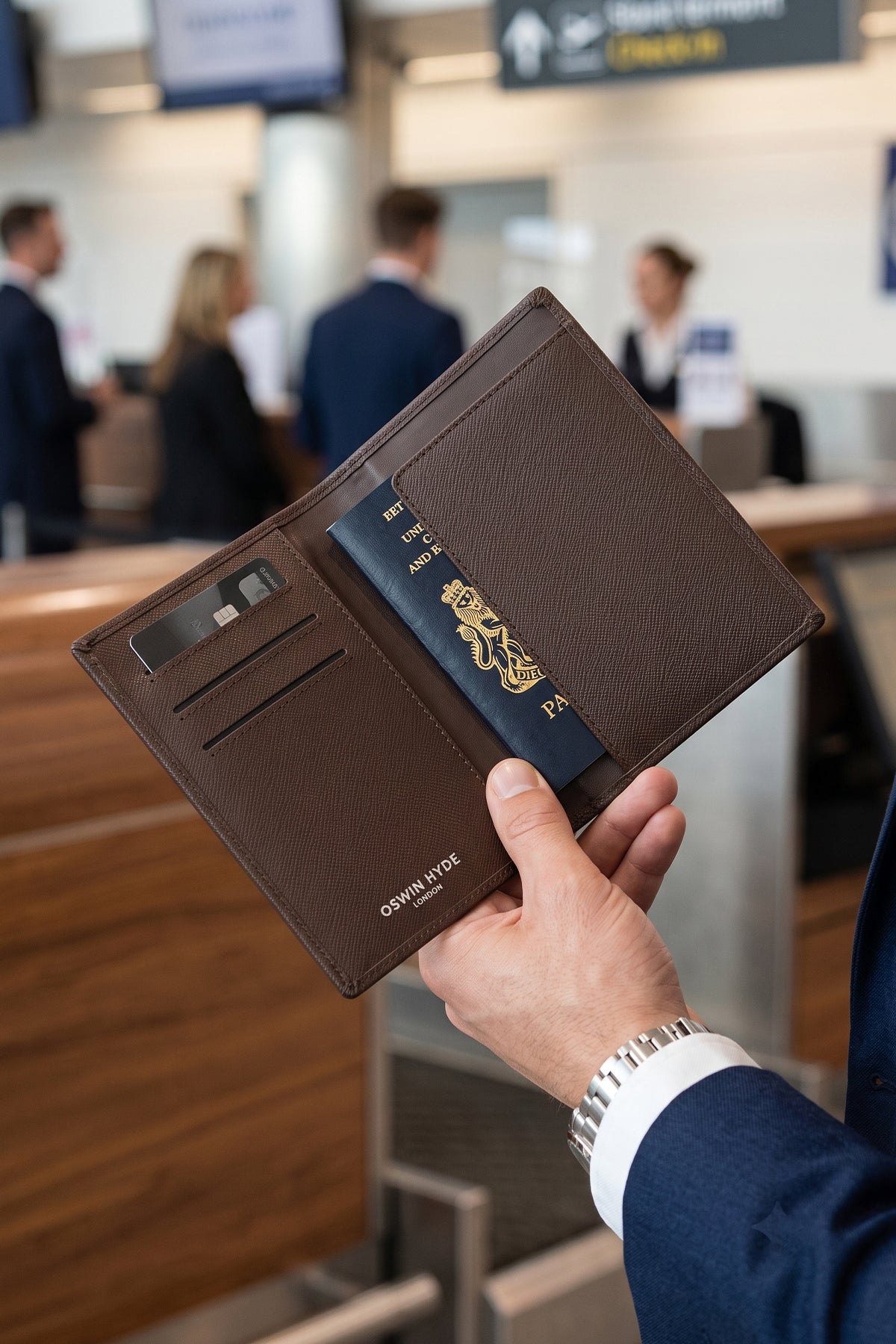 Man holding Covent Brown Passport Holder | Oswin Hyde