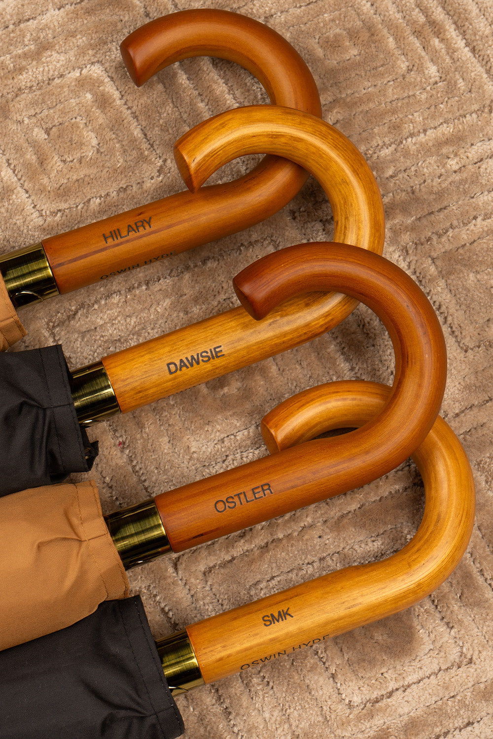 Joseph Sand men’s windproof umbrella with wooden J-handle, combining classic style and durable construction for elegant all-weather protection.