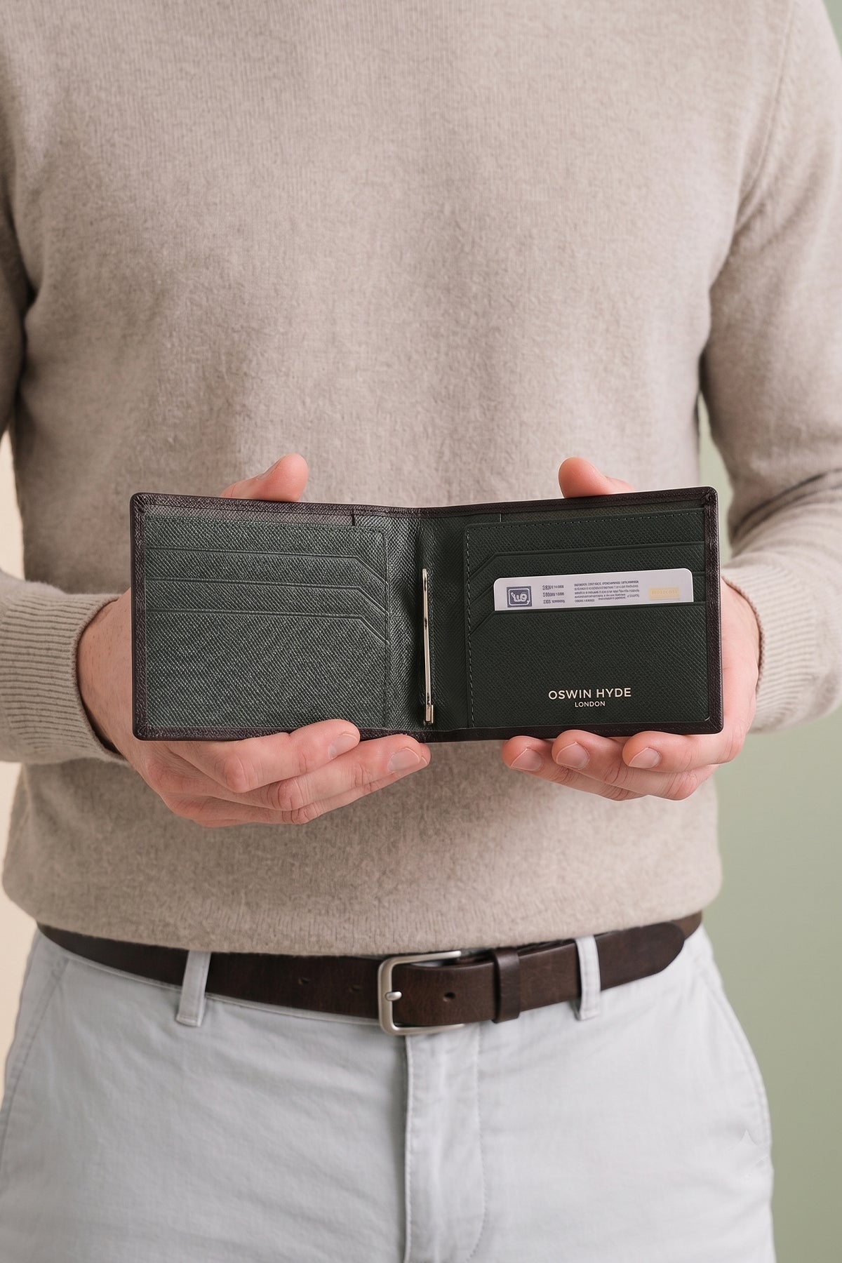 Man holding Sloane Green Money Clip Wallet | Oswin Hyde