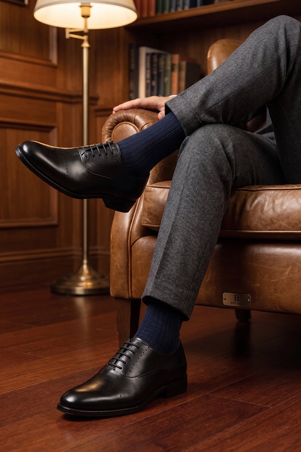 Model wearing Edward Black Oxford men’s leather shoes featuring sleek lace-up design, premium leather craftsmanship, and classic formal style.