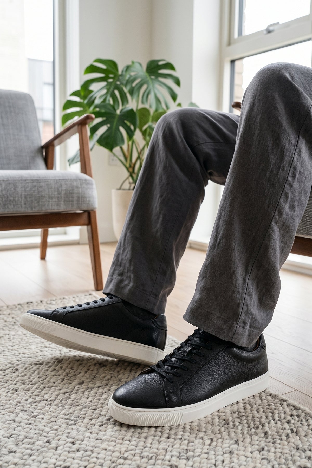 Model wearing Oswin Hyde Harper Black Grain with white milled leather exuding sophistication and style