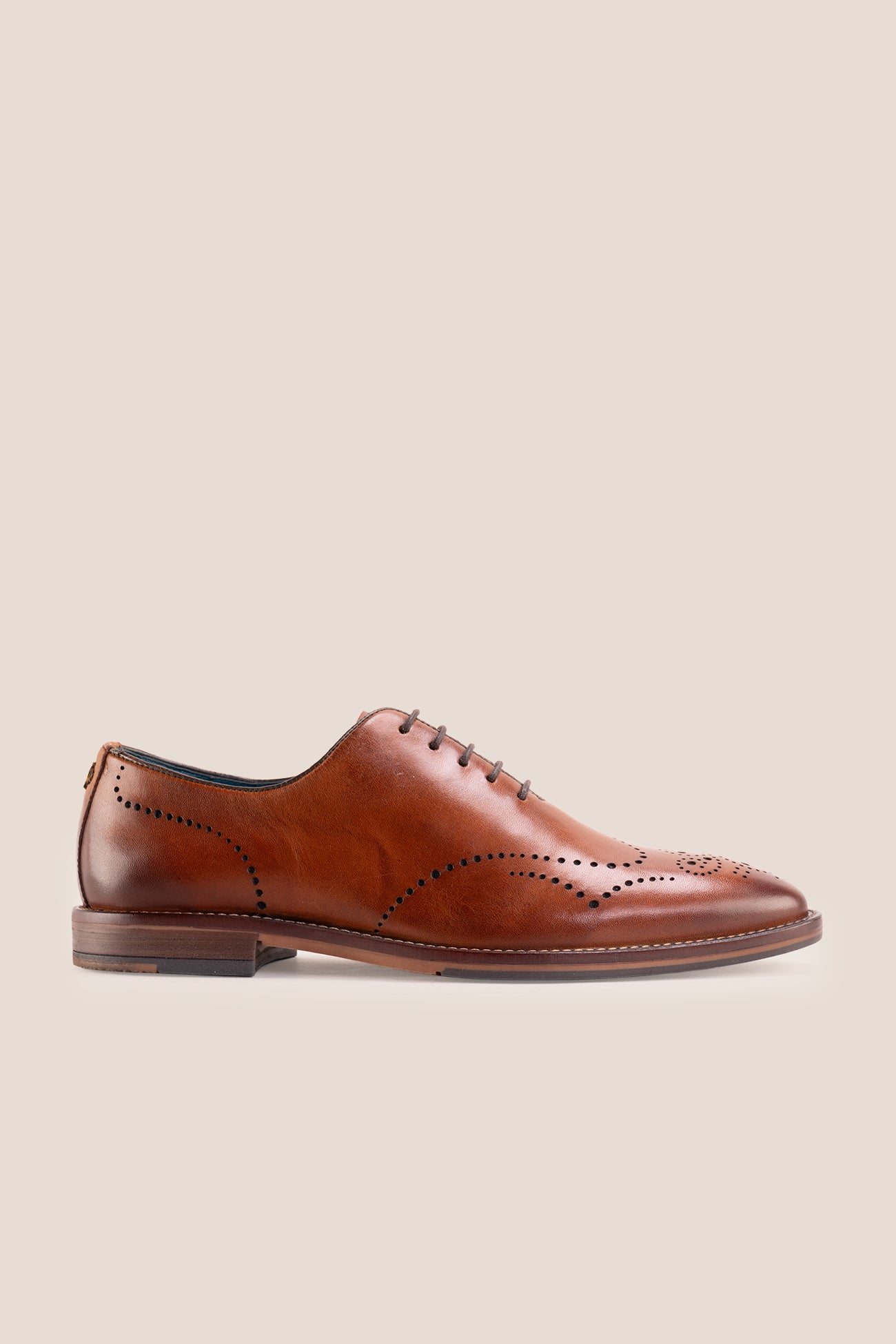 Oswin Hyde London premium Tan leather wingtip brogues with a toe medallion pattern, contrast welt stitching, and a cushioned teal interior.