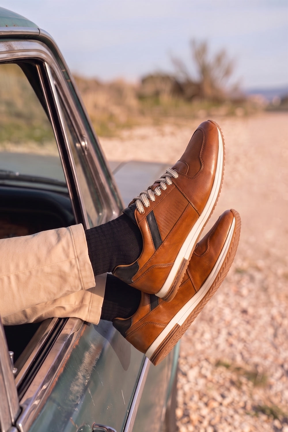 Rory Tan leather sneakers for men, featuring a classic design that exudes timeless elegance