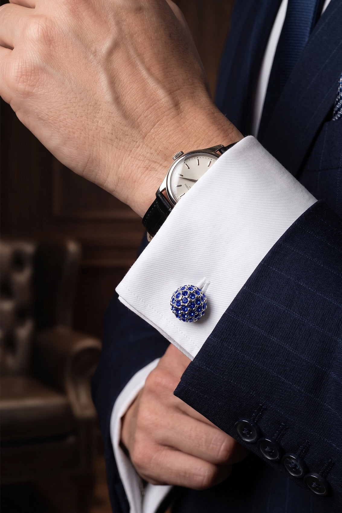 Sphere blue men’s cufflinks with sparkling blue rhinestones set in silver-tone metal, crafted in a polished spherical design.