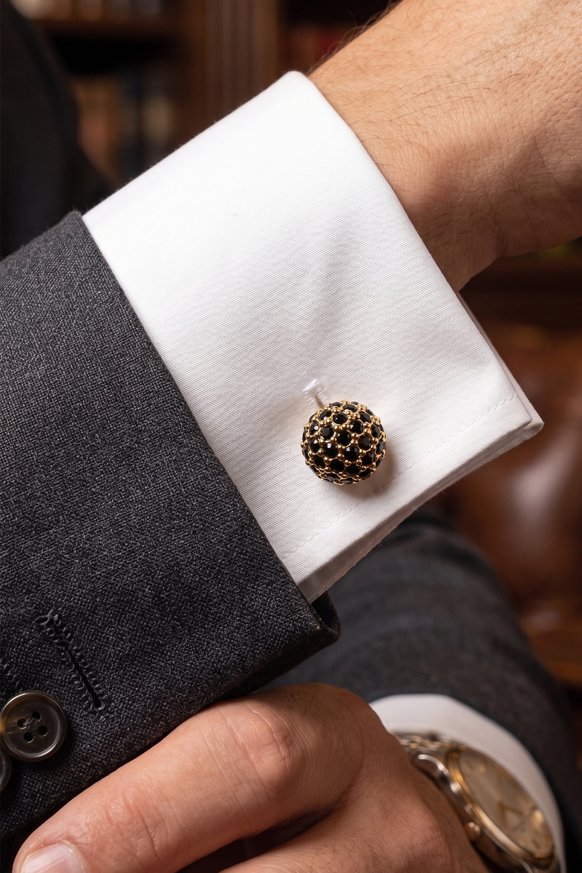 Sphere gold cufflinks with black crystals by Oswin Hyde – luxury men’s formal accessory featuring polished gold finish and elegant crystal inlay.