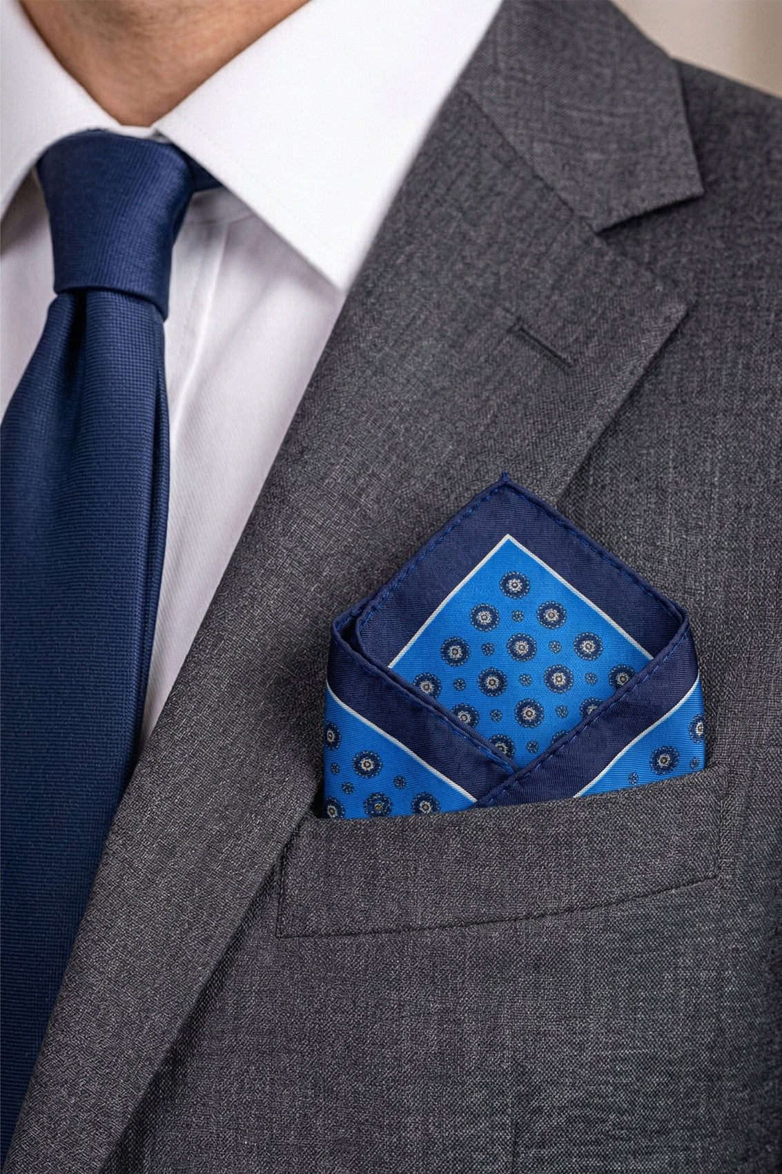 Men’s navy silk handkerchief with an intricate geometric pattern, crafted for wedding, formal, or elegant smart attire.