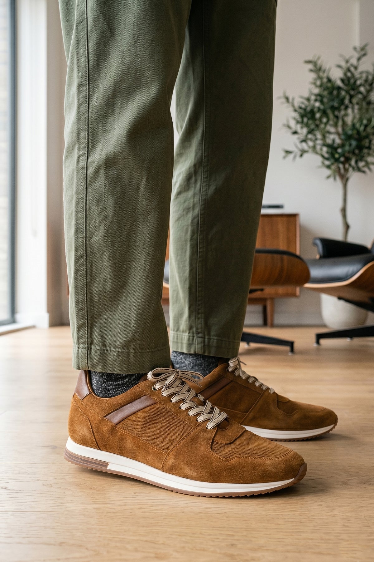 Model wearing Rory sand suede leather sneakers for men, showcasing premium craftsmanship and durable construction for stylish everyday wear
