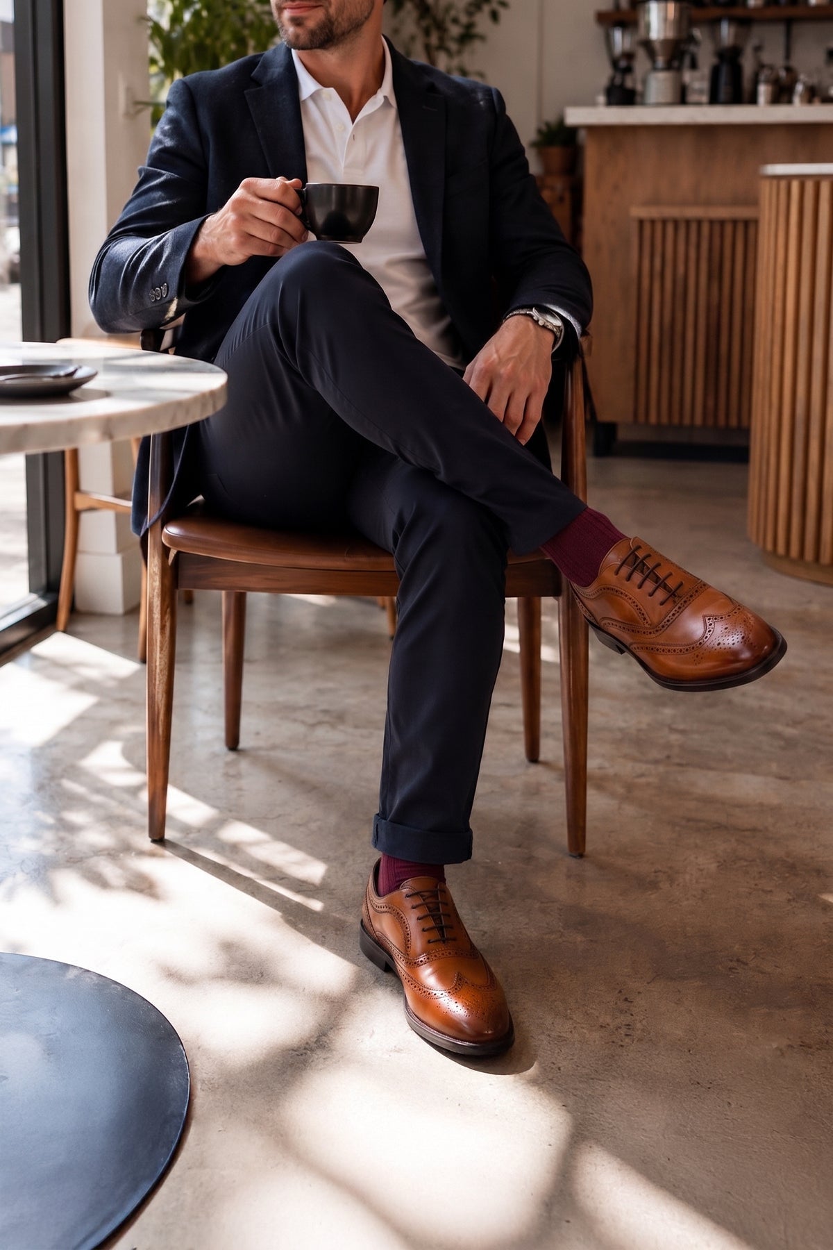 Model wearing Stokes Tan Oxford Brogues for men in premium leather with detailed broguing, perfect for formal wear or dressing up smart casual looks.