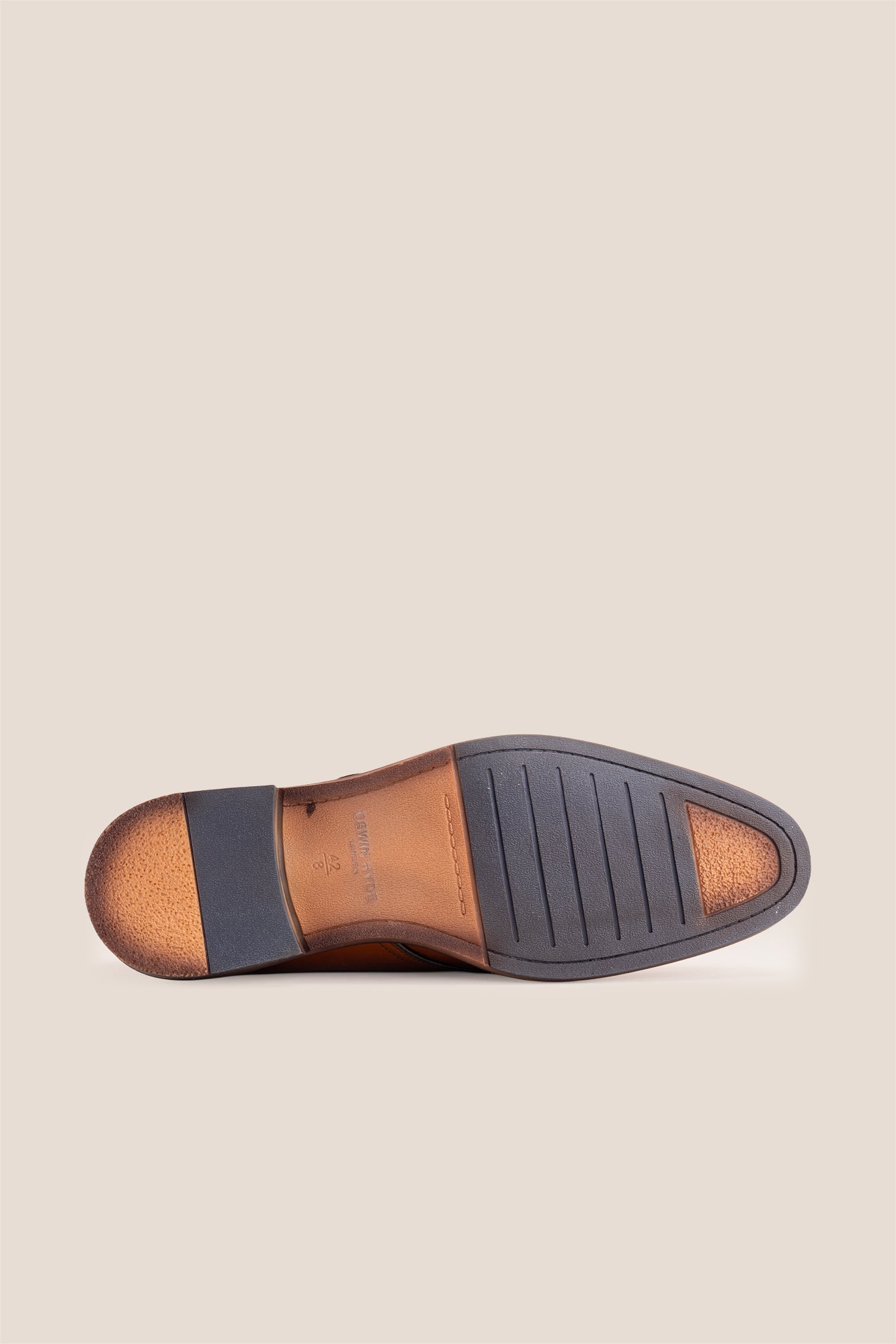 Premium men's tan leather single monk strap dress shoes by Oswin Hyde London featuring a plain toe, adjustable golden buckle, contrast sole stitching, and a cushioned teal interior.