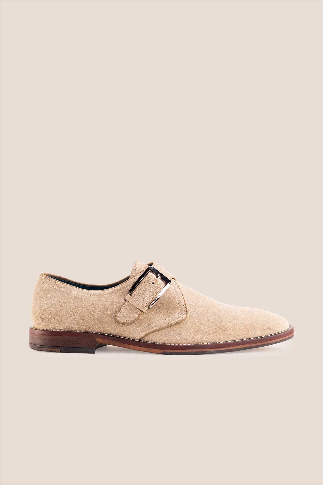 Premium men's sand suede single monk strap shoes by Oswin Hyde London, featuring a plain toe, adjustable silver buckle, contrast sole stitching, and a cushioned teal interior.