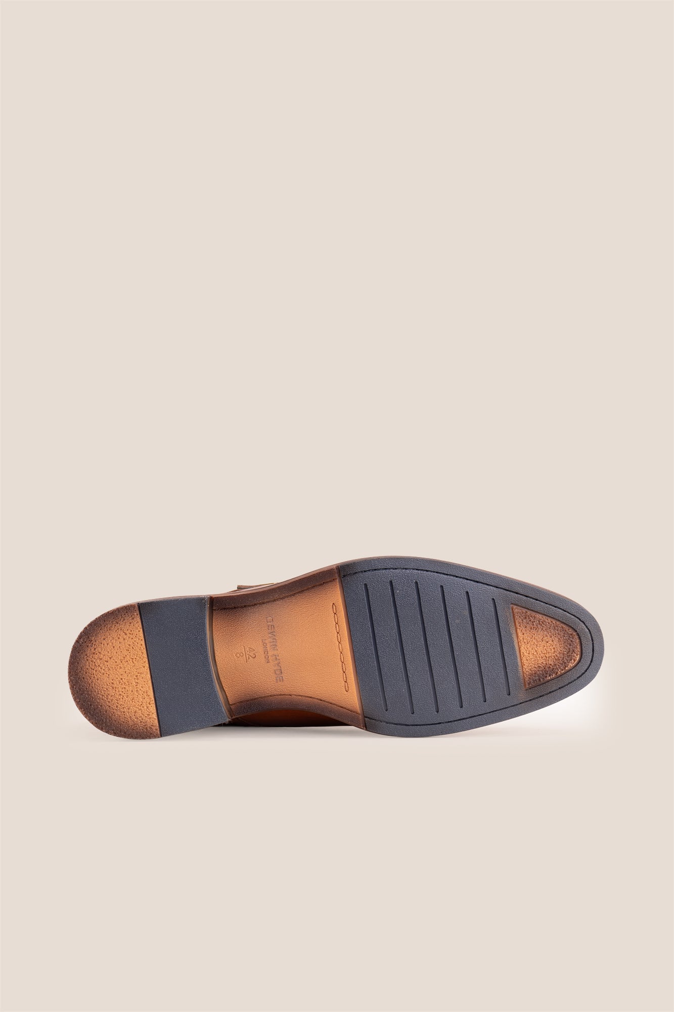 Kayden Tan leather monk strap shoes by OSWIN HYDE for men. Toe cap designed with saffiano print, cushioned insole and padded topline.