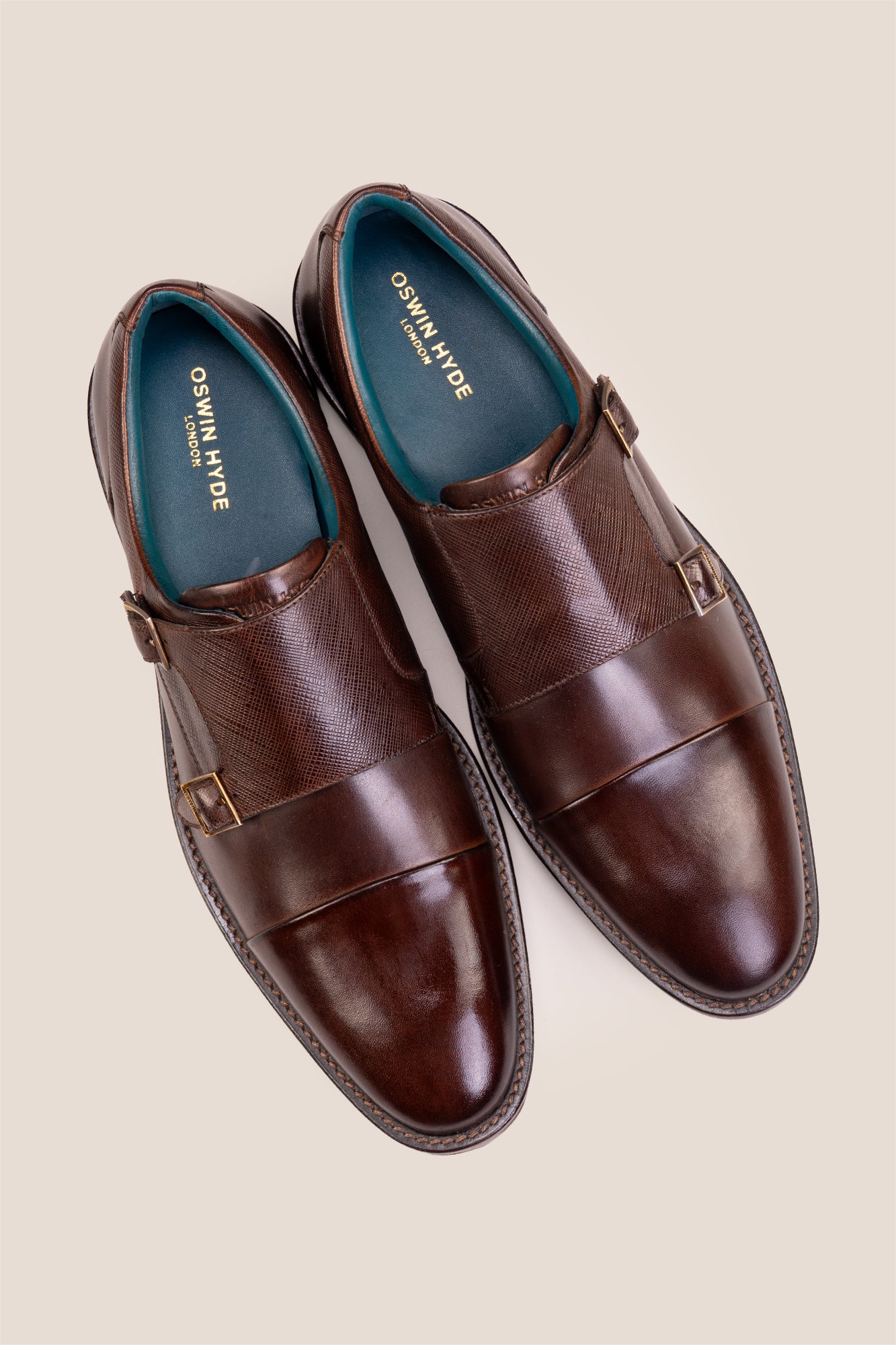 Kayden Brown leather monk strap shoes by OSWIN HYDE for men. Toe cap designed with saffiano print, cushioned insole and padded topline.