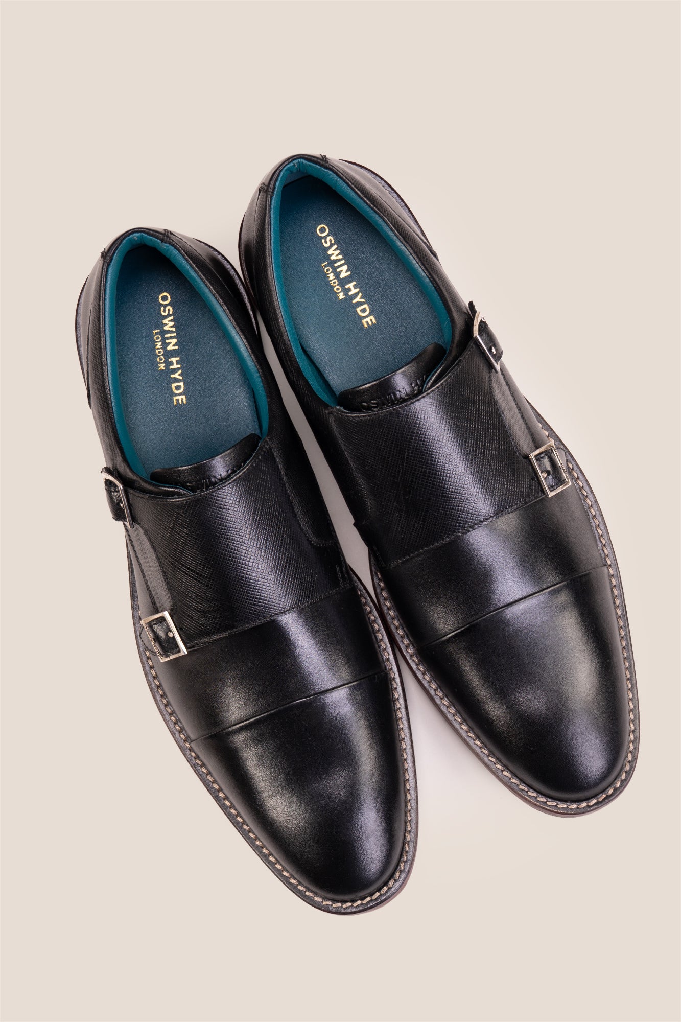 Kayden Black leather monk strap shoes by OSWIN HYDE for men. Toe cap designed with saffiano print, cushioned insole and padded topline.