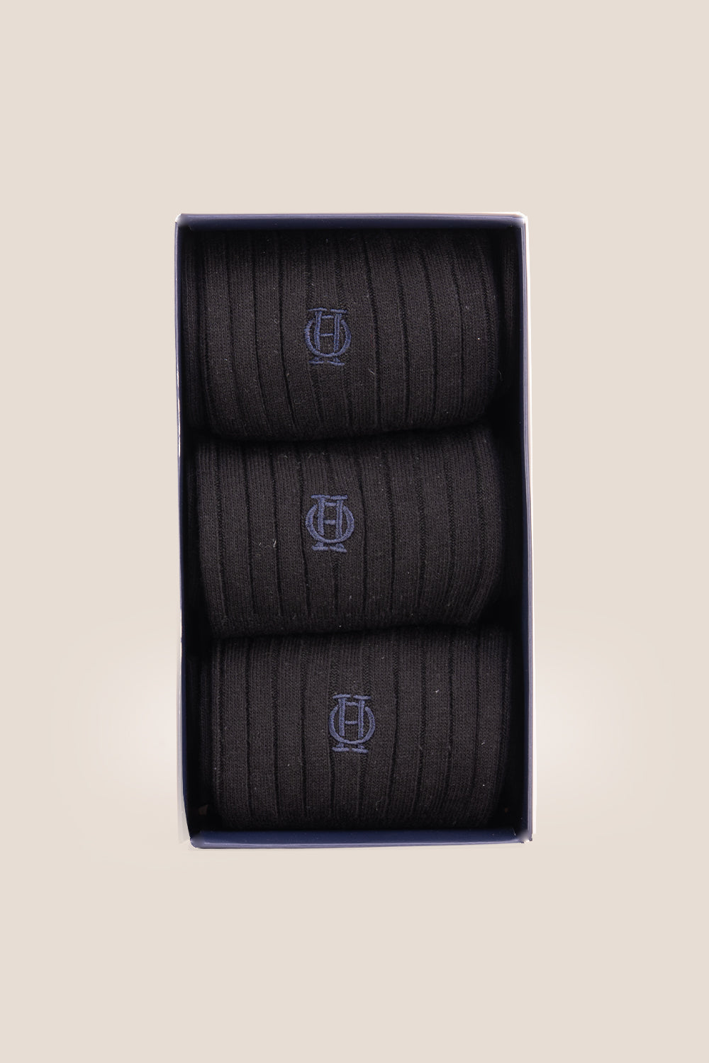 Three pairs of premium black cotton socks designed by Oswin Hyde for the discerning gentleman.