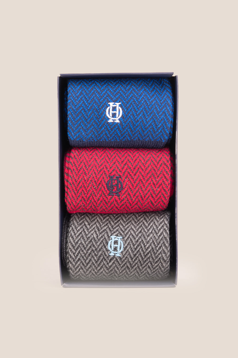 Three pairs of premium herringbone socks designed by Oswin Hyde for the discerning gentleman.