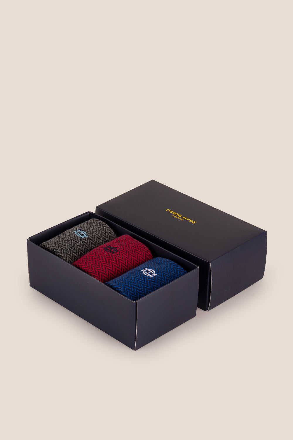 Three pairs of premium herringbone socks designed by Oswin Hyde for the discerning gentleman.