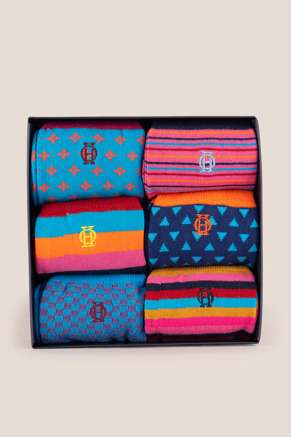 Oswin Hyde Contemporary six pairs of premium socks for men, featuring unique designs and timeless block colours.