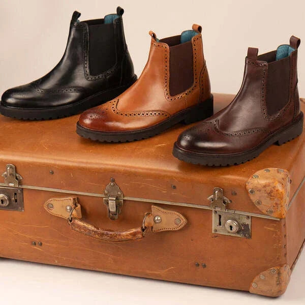 Leather Chelsea boots being cleaned and conditioned