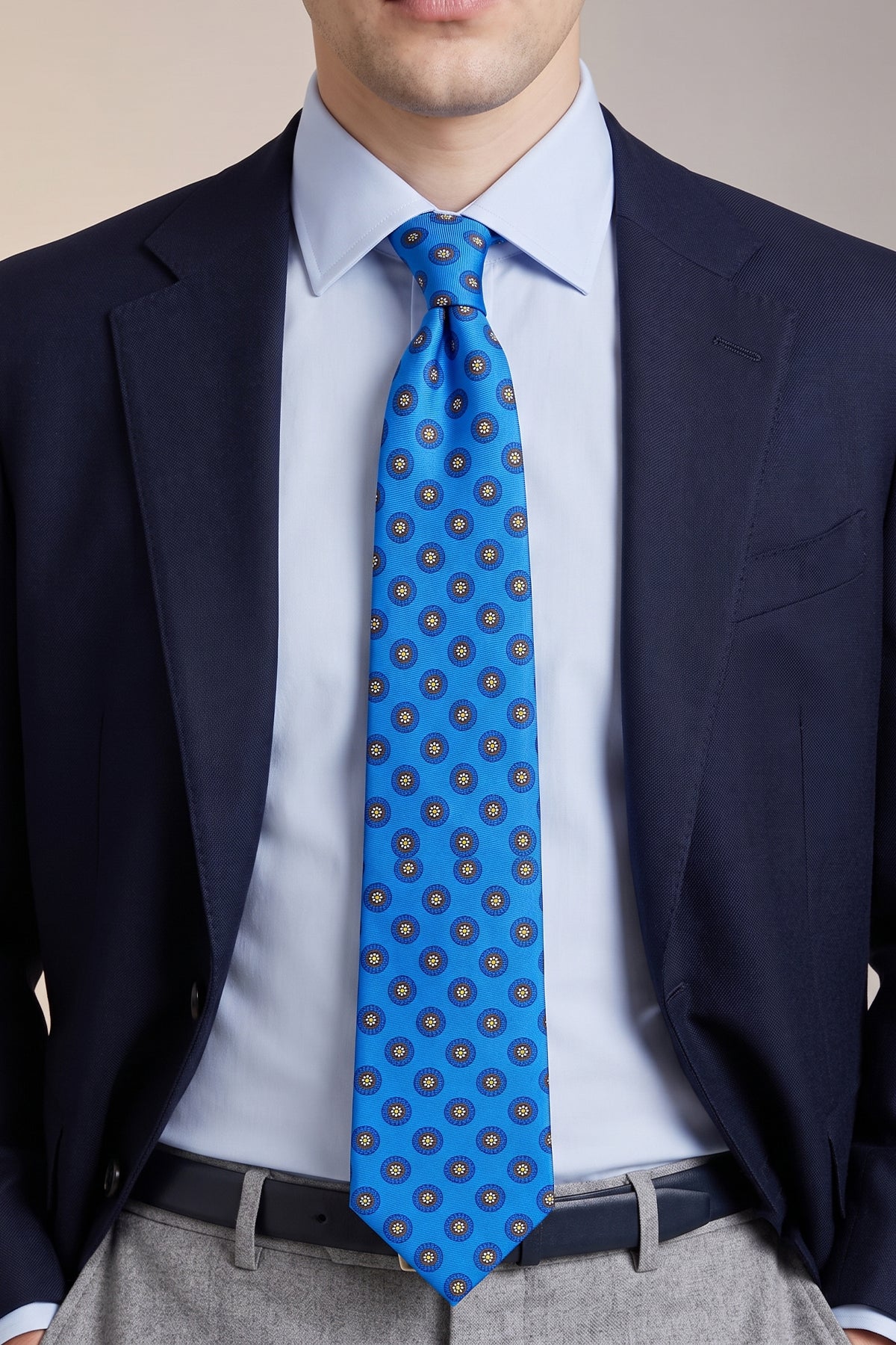 Man wearing Blue Geometric Pattern Silk Tie with striking design, ideal for weddings, formal events, and smart attire.