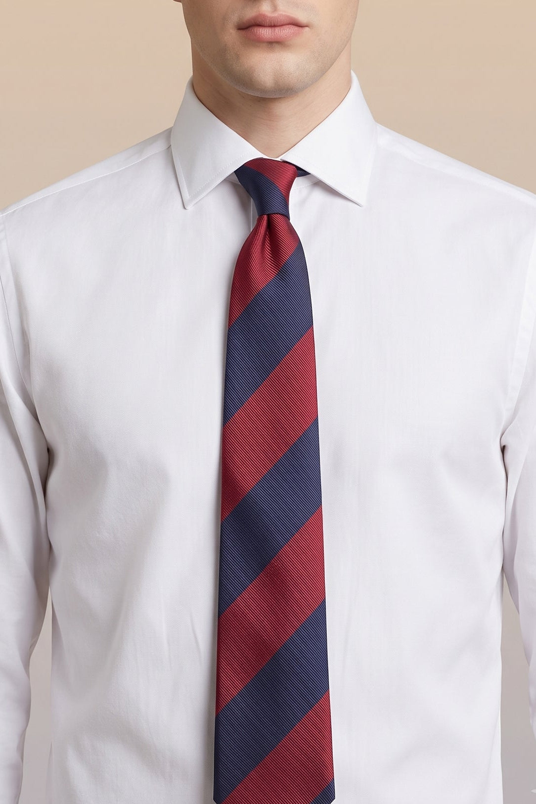Man wearing Red Navy Stripes tie for men, designed to add a bold and elegant touch to your wardrobe. Featuring striking red and navy stripes made from high quality materials.