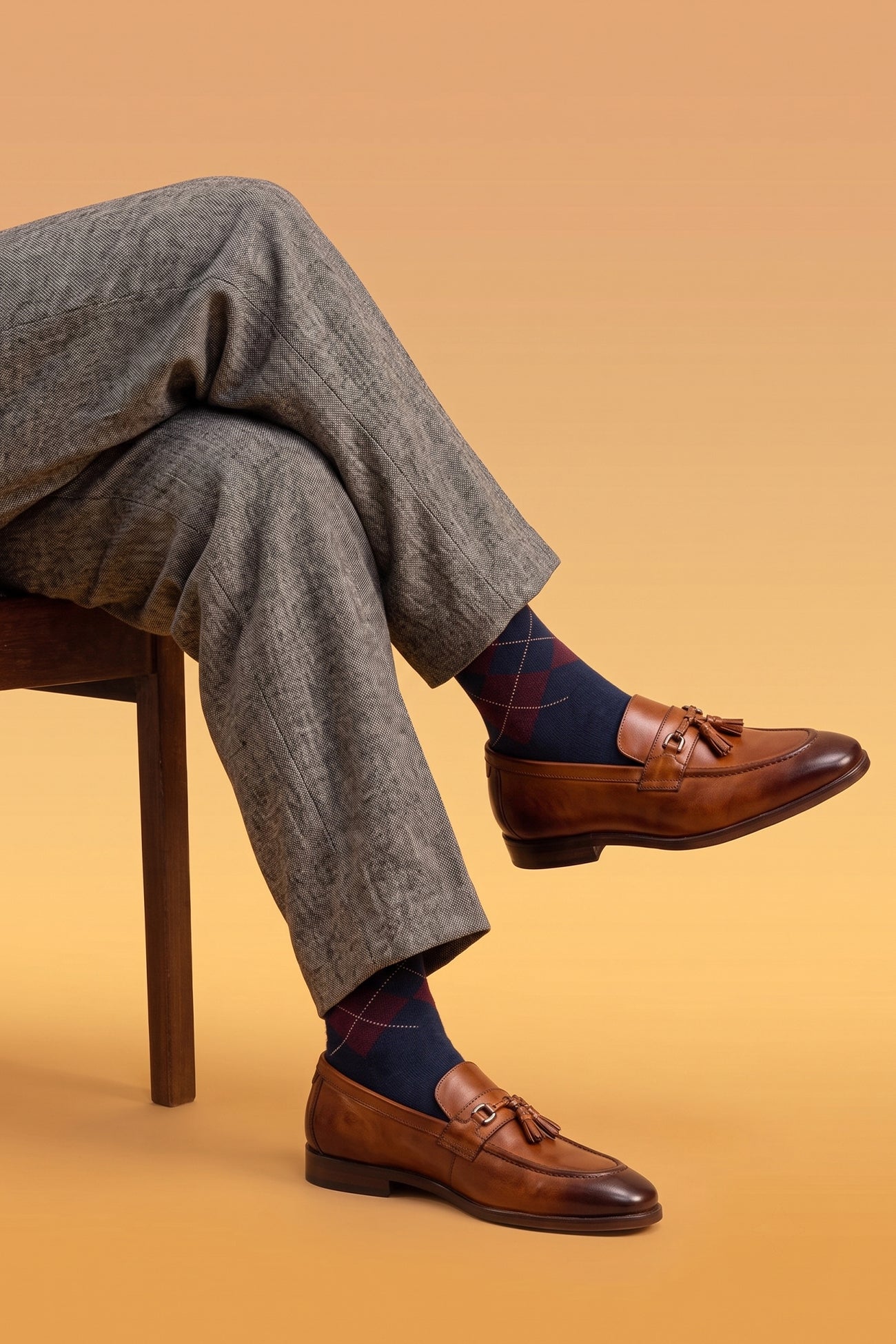 Model wearing Emmet Tan men’s leather loafers featuring premium tan leather with tassel trim, ideal for formal and smart casual wear.
