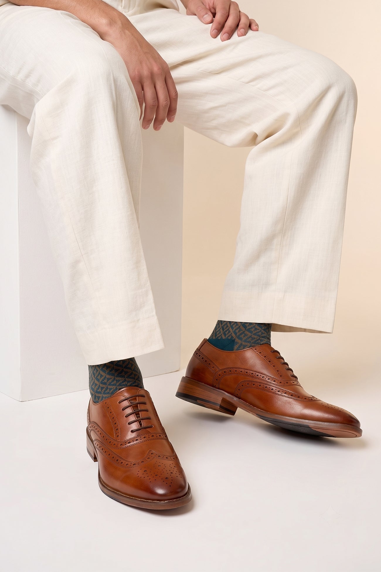 Model wearing Winston tan Oxford brogue leather shoes for men with intricate detailing, crafted from premium leather for weddings, work, and formal occasions.
