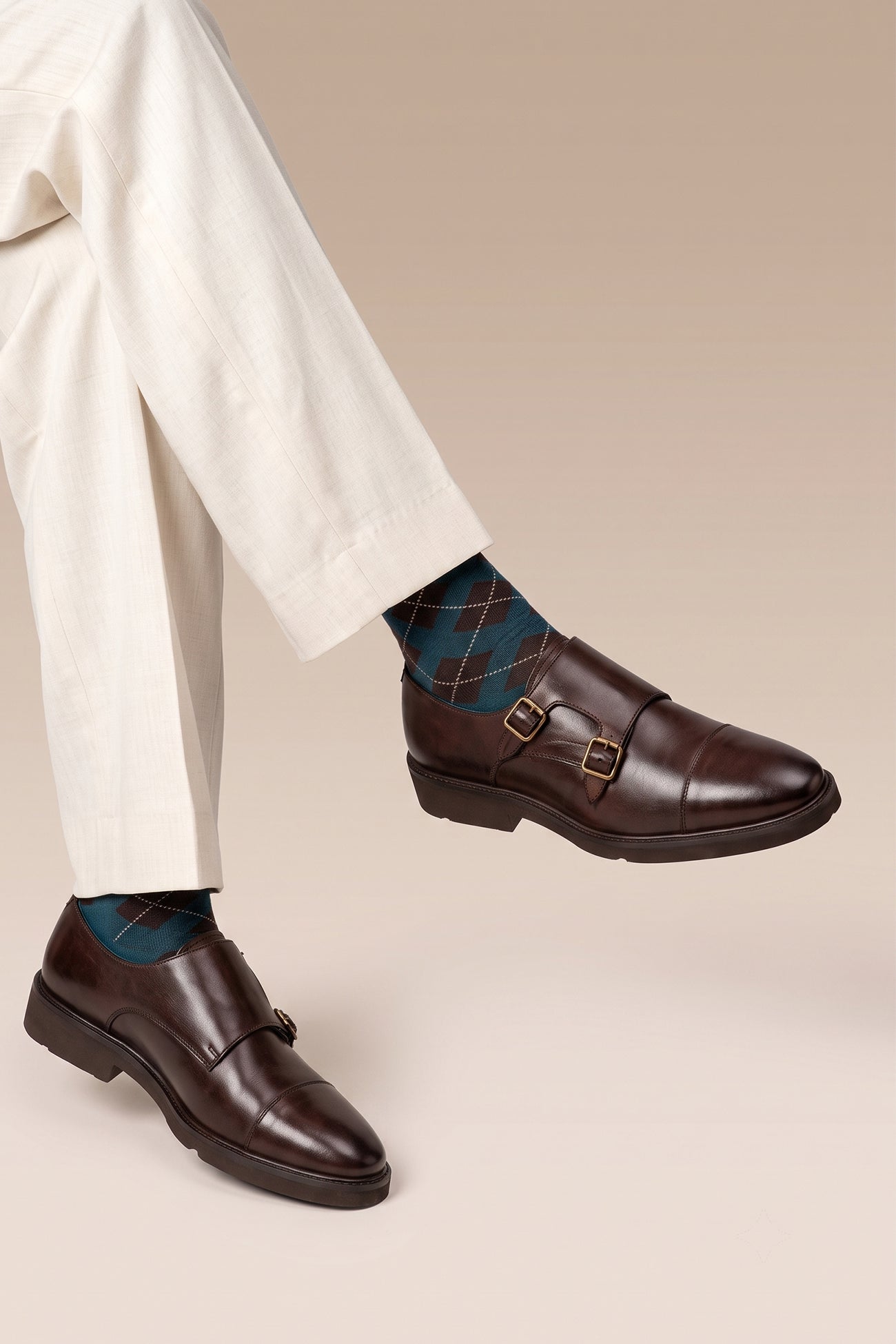 Man wearing Garson brown monk strap leather men’s shoes with premium craftsmanship, sleek design, and classic buckle detail for formal and office wear.