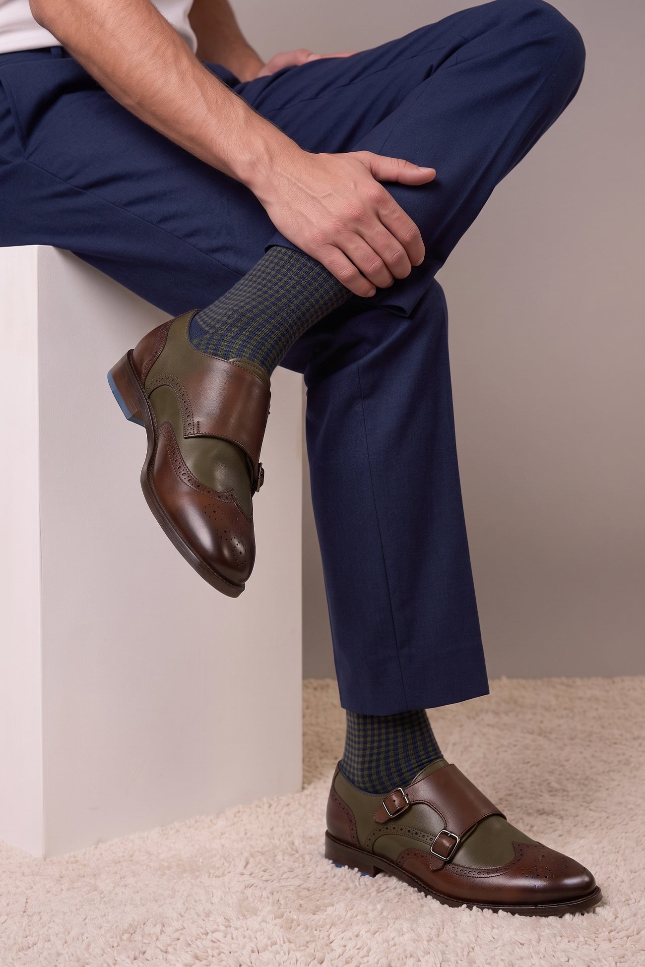 Model wearing Men’s Warren brown monk strap brogue shoes with wing cap design, crafted in premium leather for formal and smart casual occasions.