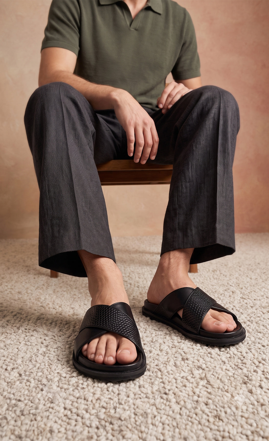 Man wearing Nyle Black cross strap sandals for men by Oswin Hyde with sleek design and comfortable fit
