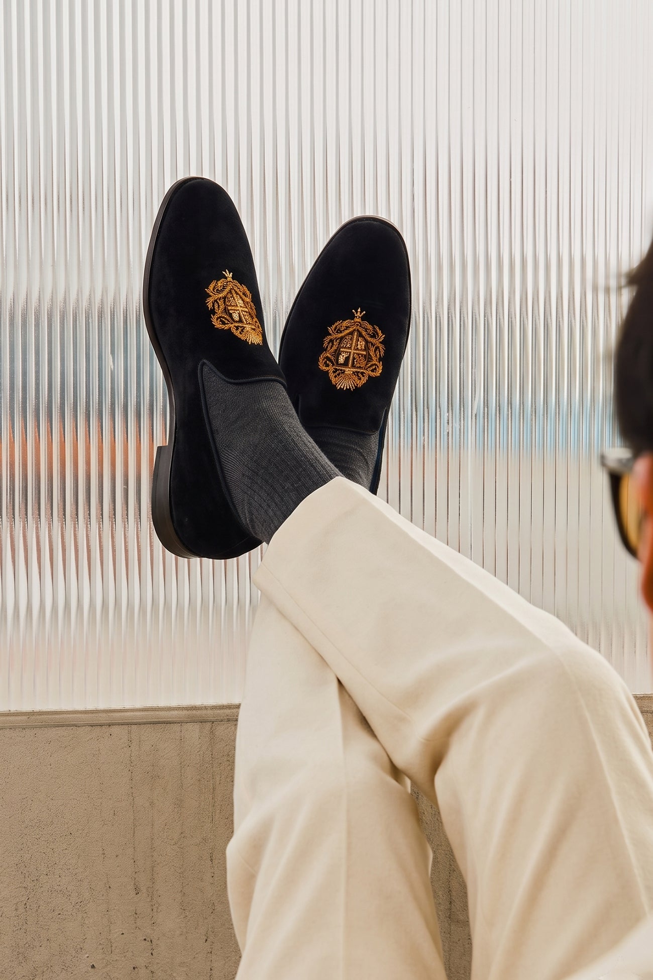 Model wearing Luther black velvet embroidered loafers for men, featuring detailed embroidery and premium velvet for elegant evening or formal style.