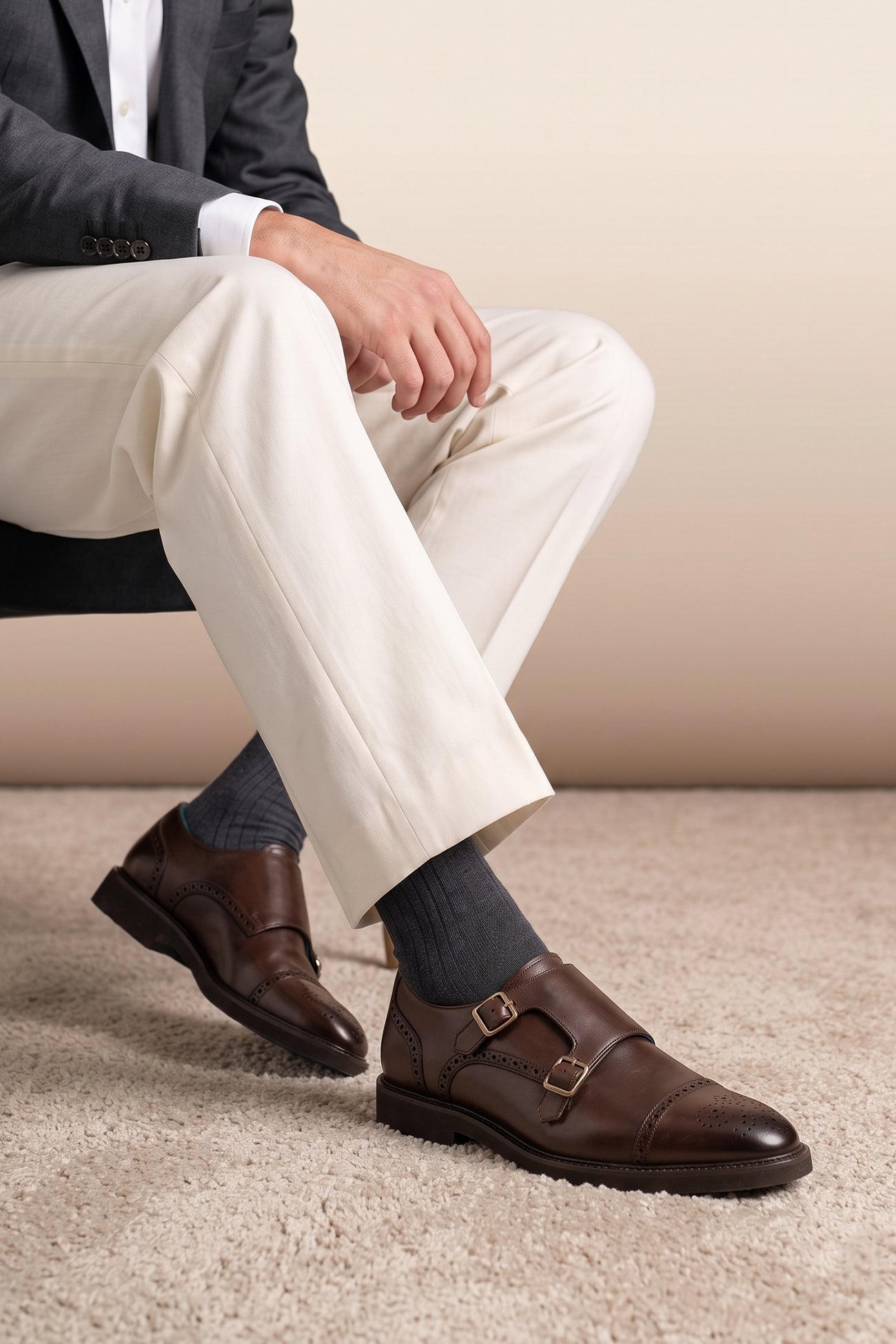 Model wearing Shelby Brown monk strap brogue leather shoes for men, crafted from premium brown leather with classic brogue detailing for formal and smart wear.