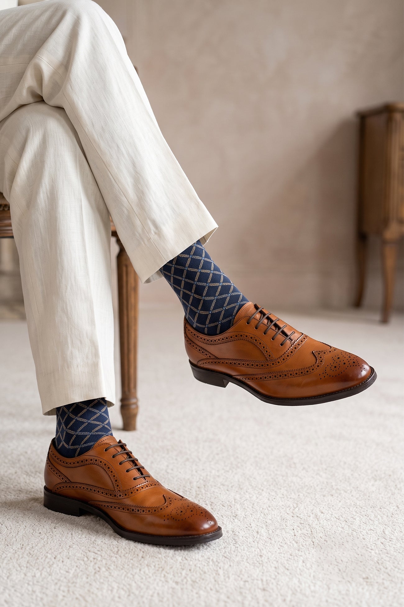 Model wearing Stokes Tan Oxford Brogues for men in premium leather with detailed broguing, perfect for formal wear or dressing up smart casual looks.