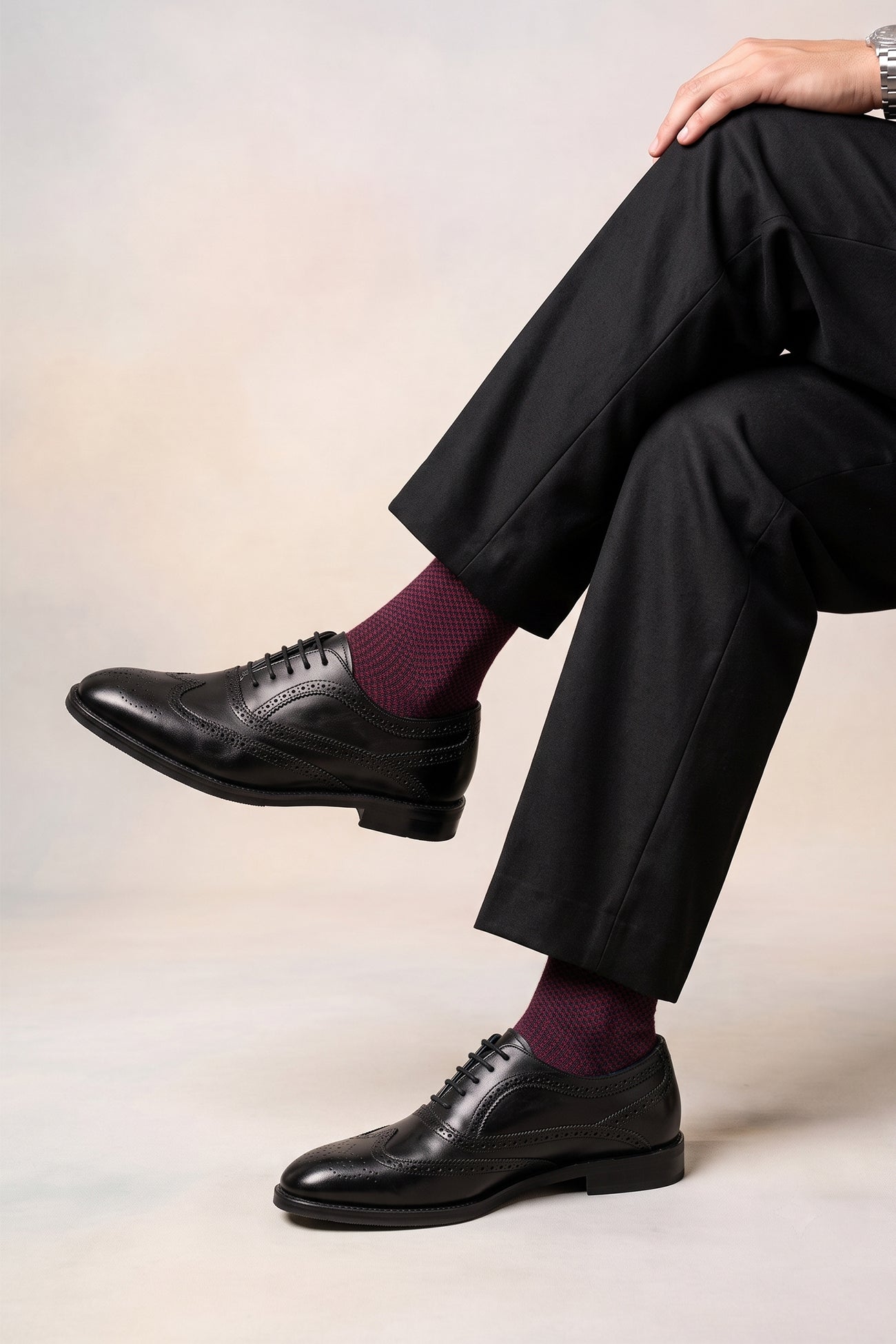 Model wearing Stokes BlackOxford Brogues for men in premium leather with detailed broguing, perfect for formal wear or dressing up smart casual looks.