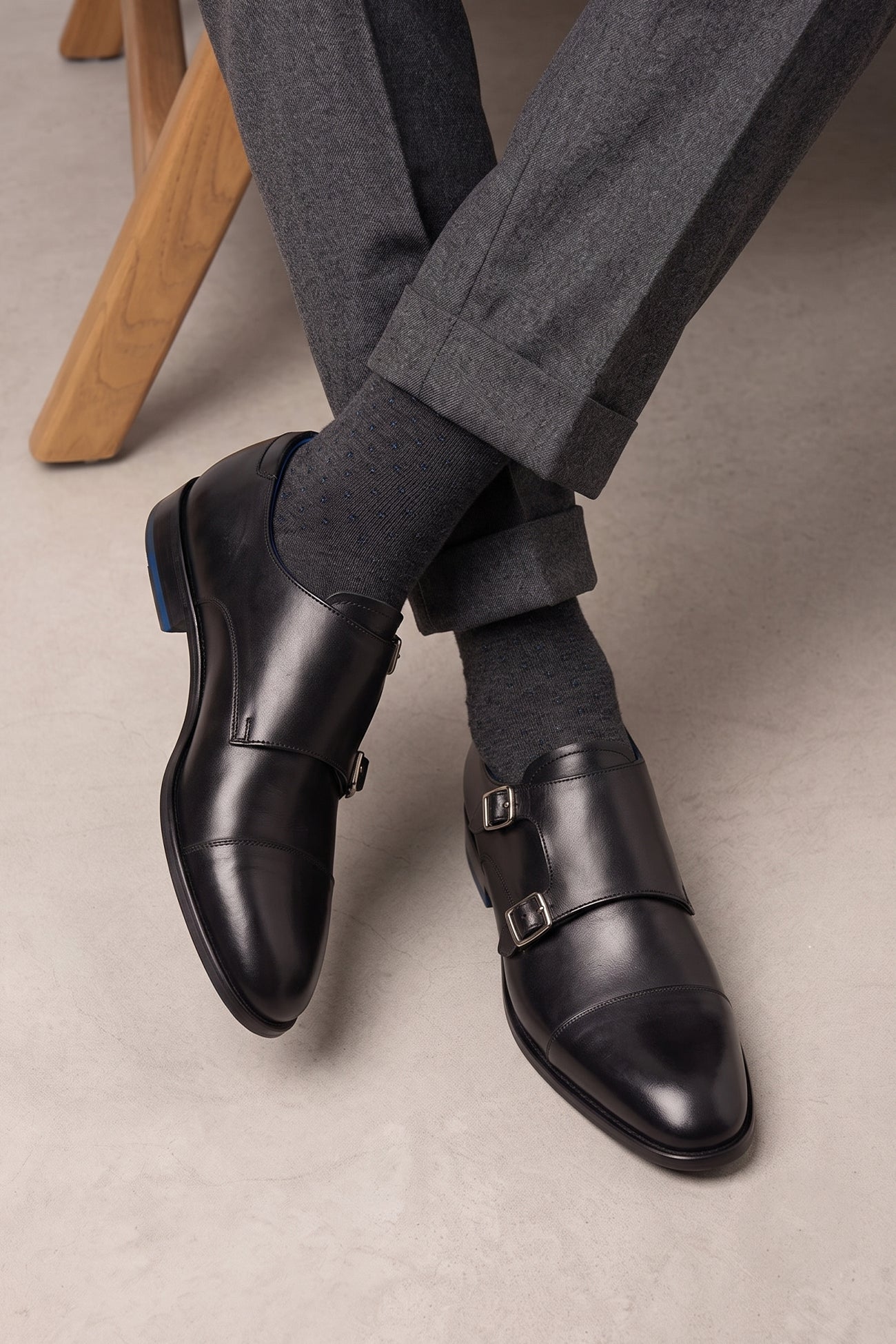 Model wearing Hadley black monk strap men’s leather shoes with sleek silhouette, single buckle detail, and polished finish—ideal for formal and business wear.