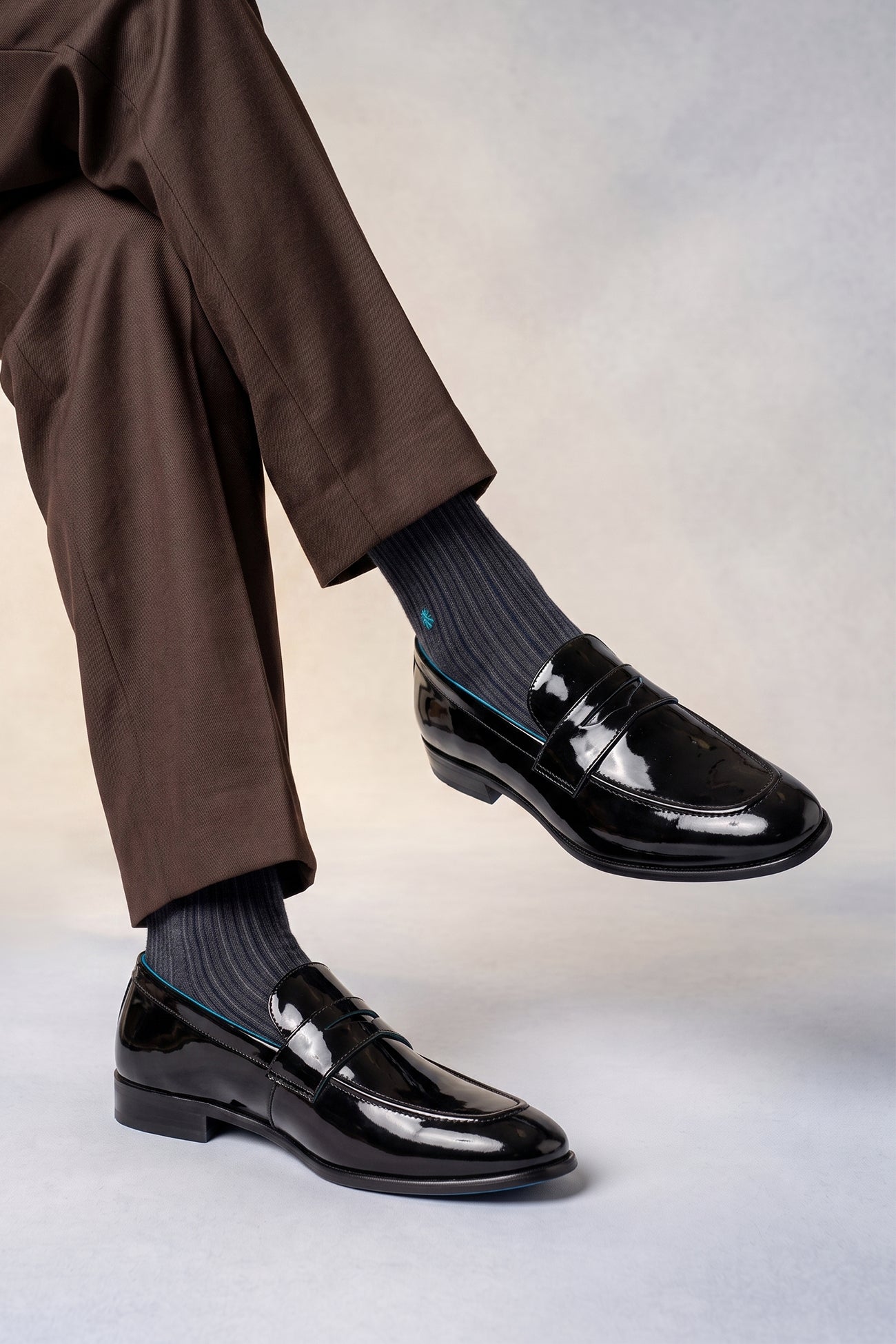 Model wearing Dayton black saddle leather loafers for men, crafted from premium leather with classic saddle design, ideal for smart casual and formal occasions.