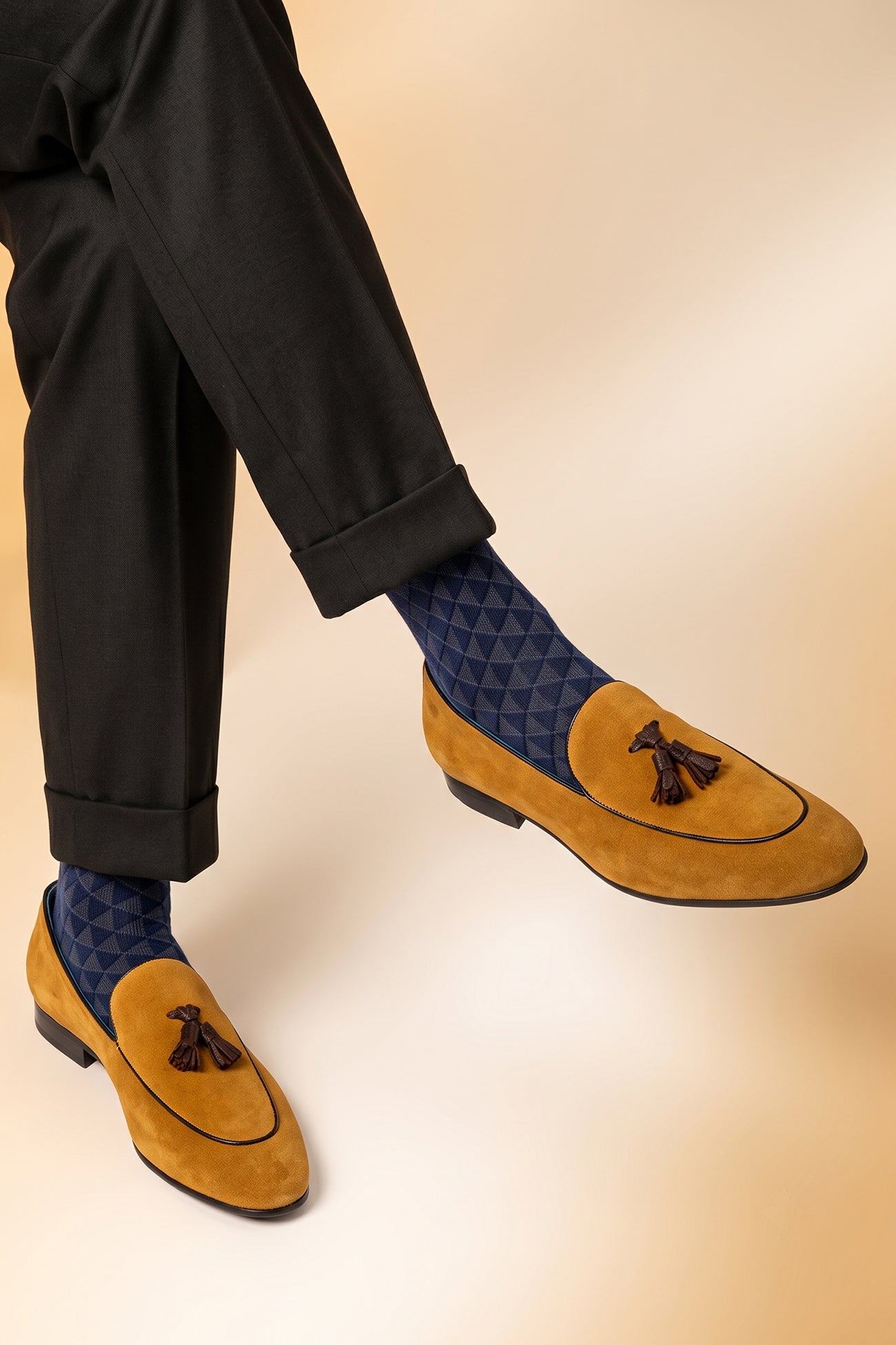 Model wearing Barclays Tan suede tassel loafer for men, crafted with premium suede and detailed tassels, perfect for formal and smart casual wear.