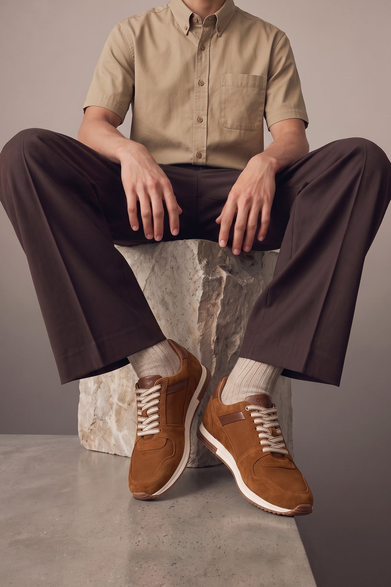 Model wearing Rory sand suede leather sneakers for men, showcasing premium craftsmanship and durable construction for stylish everyday wear