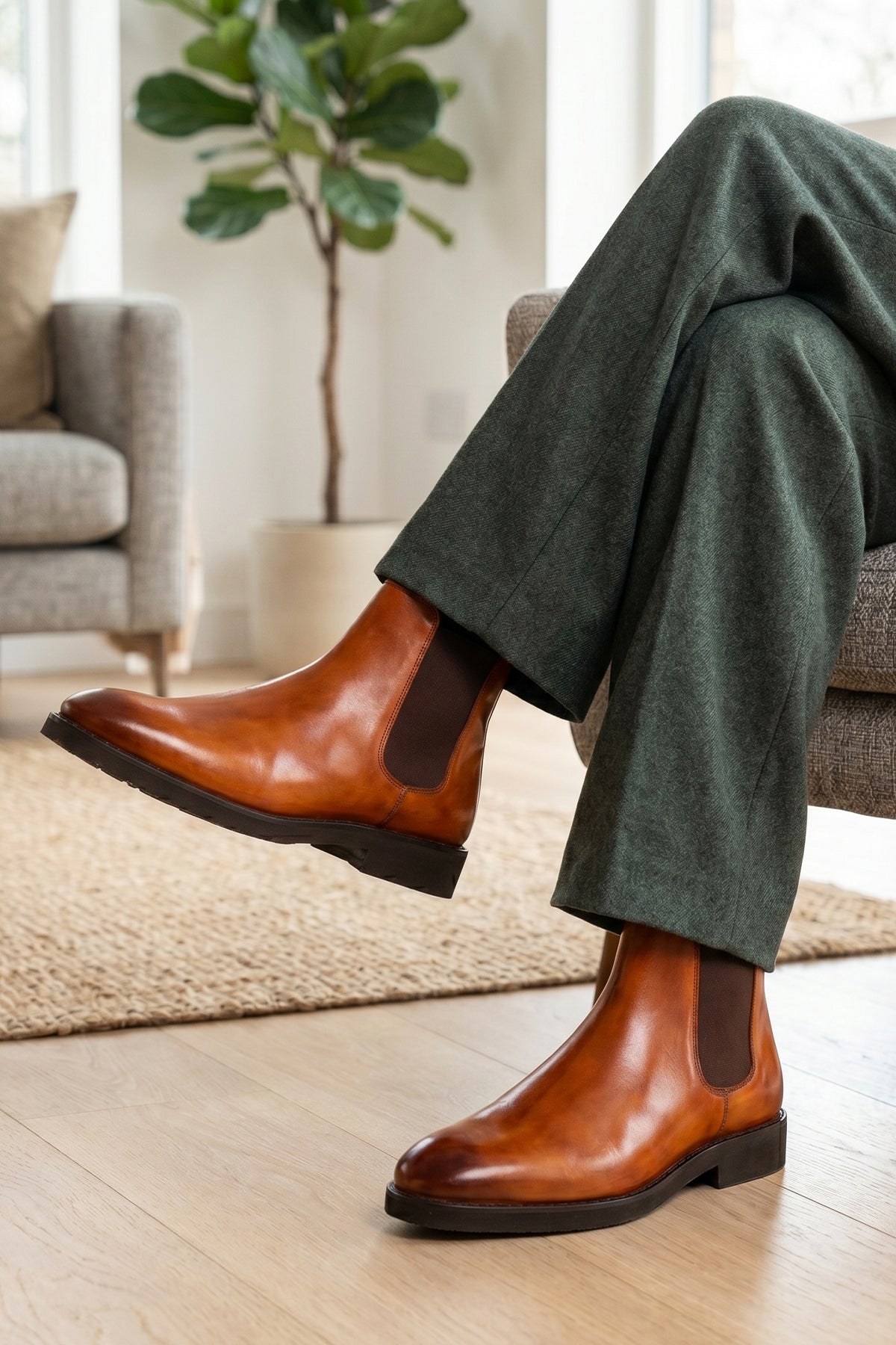 Man wearing Michael tan leather Chelsea boots for men with elastic sides and pull tab, perfect for smart-casual and formal wear.