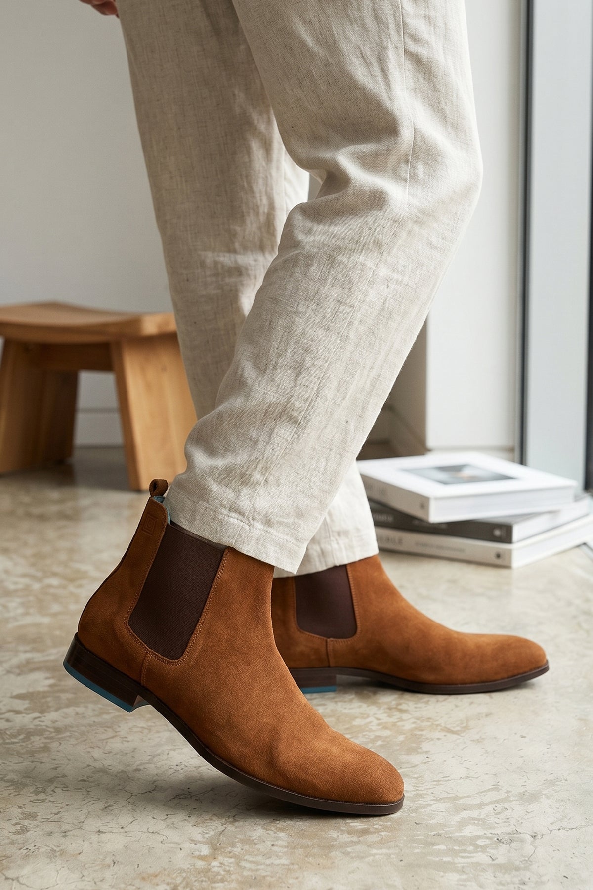 Man wearing Vinnie tobacco suede Chelsea boots for men by Oswin Hyde – premium suede upper with sleek silhouette and stacked heel for stylish, comfortable wear.