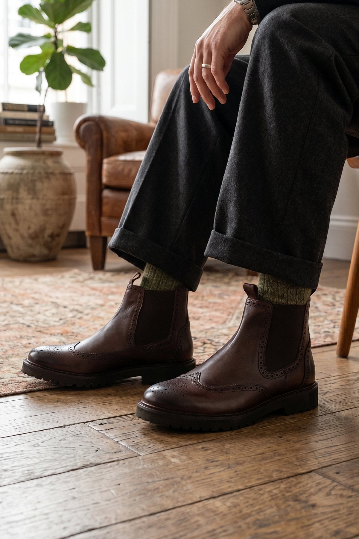 Man wearing Grant Brown men’s leather brogue Chelsea boots with chunky sole, lightweight construction, and comfortable fit for smart and casual occasions.