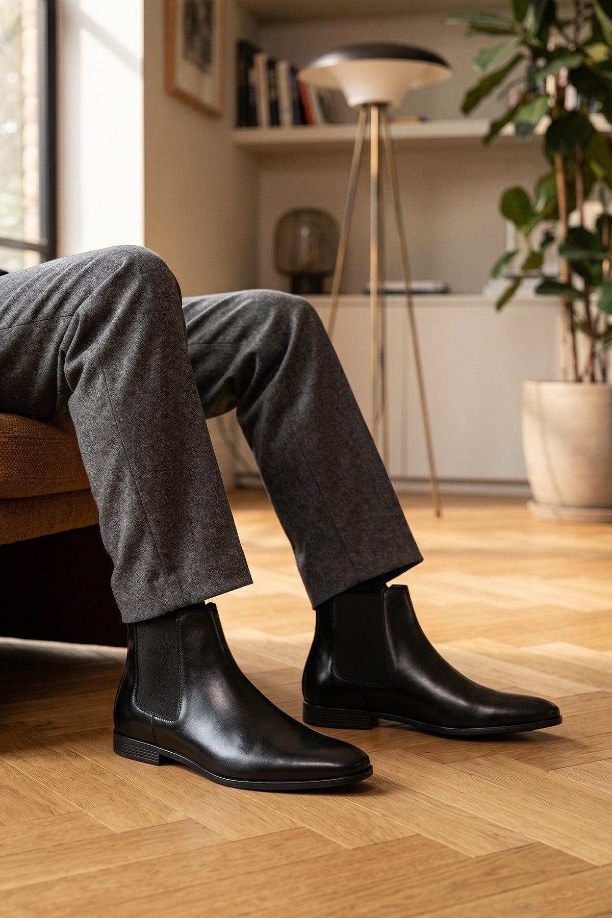 Man wearing Darwin mens Leather Chelsea boots in Black, ideal for weddings, casual and formal events. 