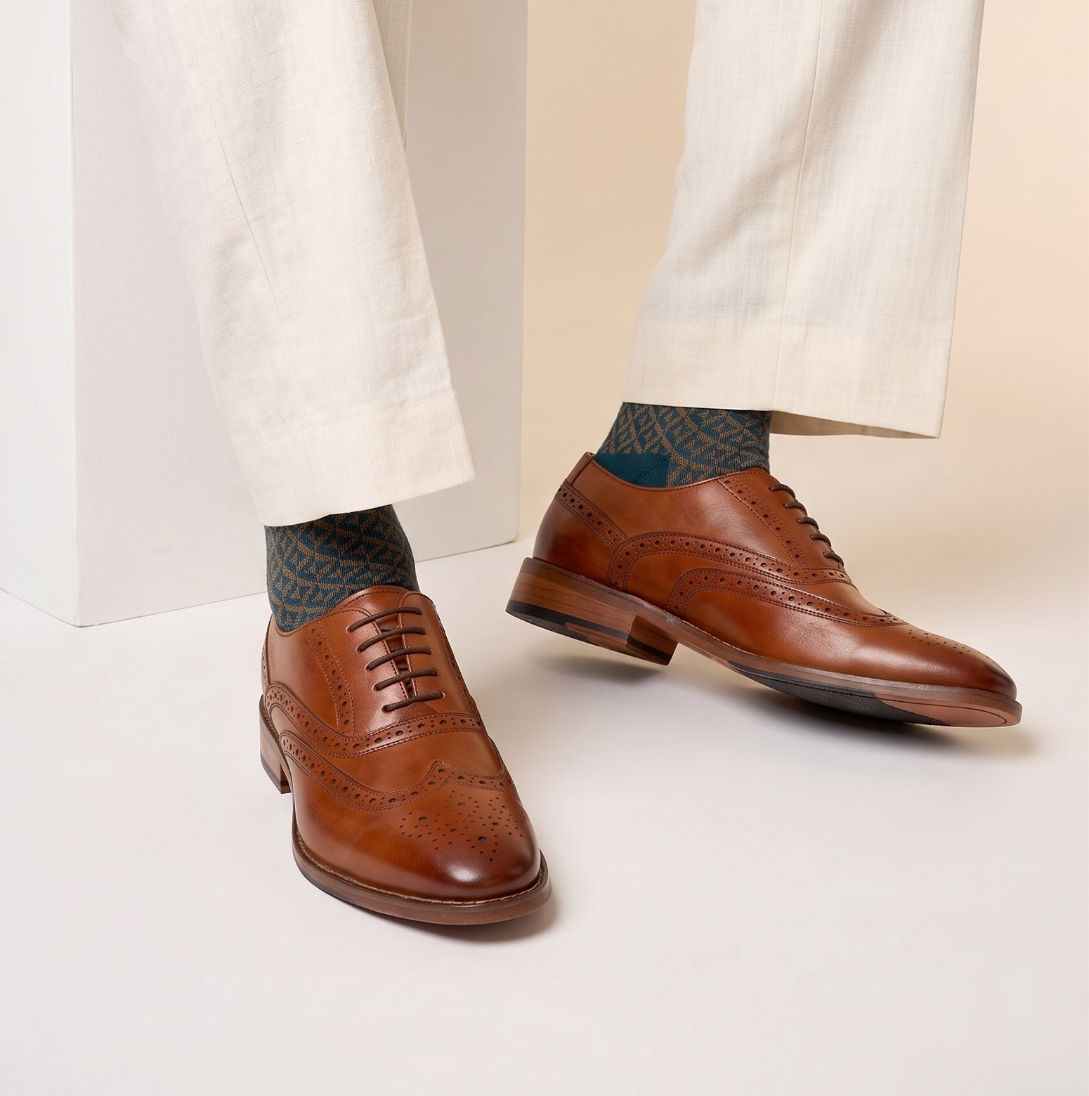 Model wearing Winston tan Oxford brogue leather shoes for men with intricate detailing, crafted from premium leather for weddings, work, and formal occasions.