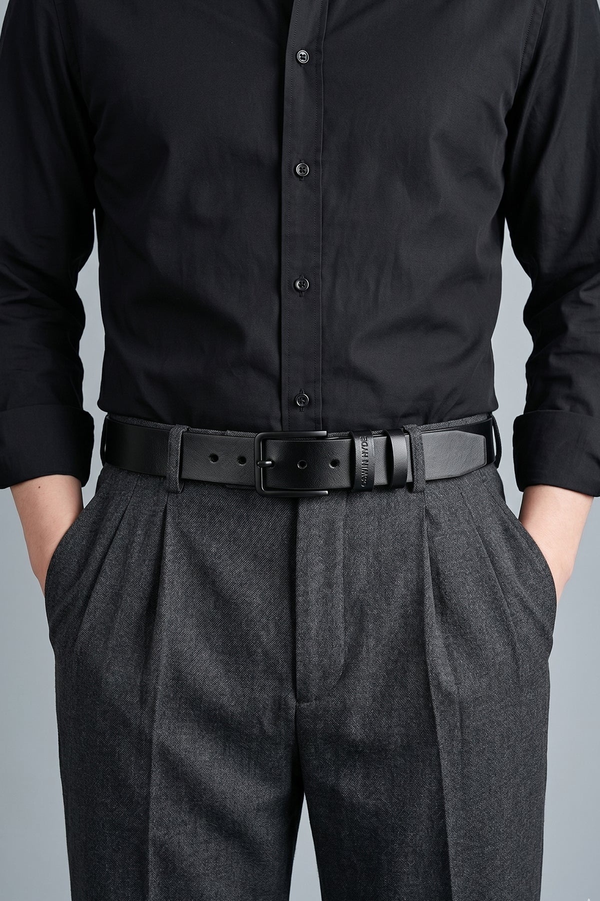 Man wearing Oswin Hyde Carl Black belt - Premium black leather with polished buckle for formal and smart wear