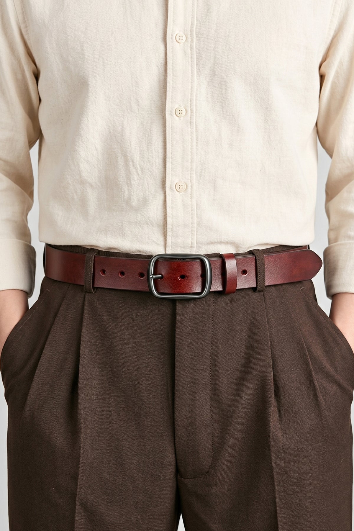 Man wearing Hunter Cherry leather belt for men perfect for casual and formal occasions. Cherry matching belt for a complete outfit.