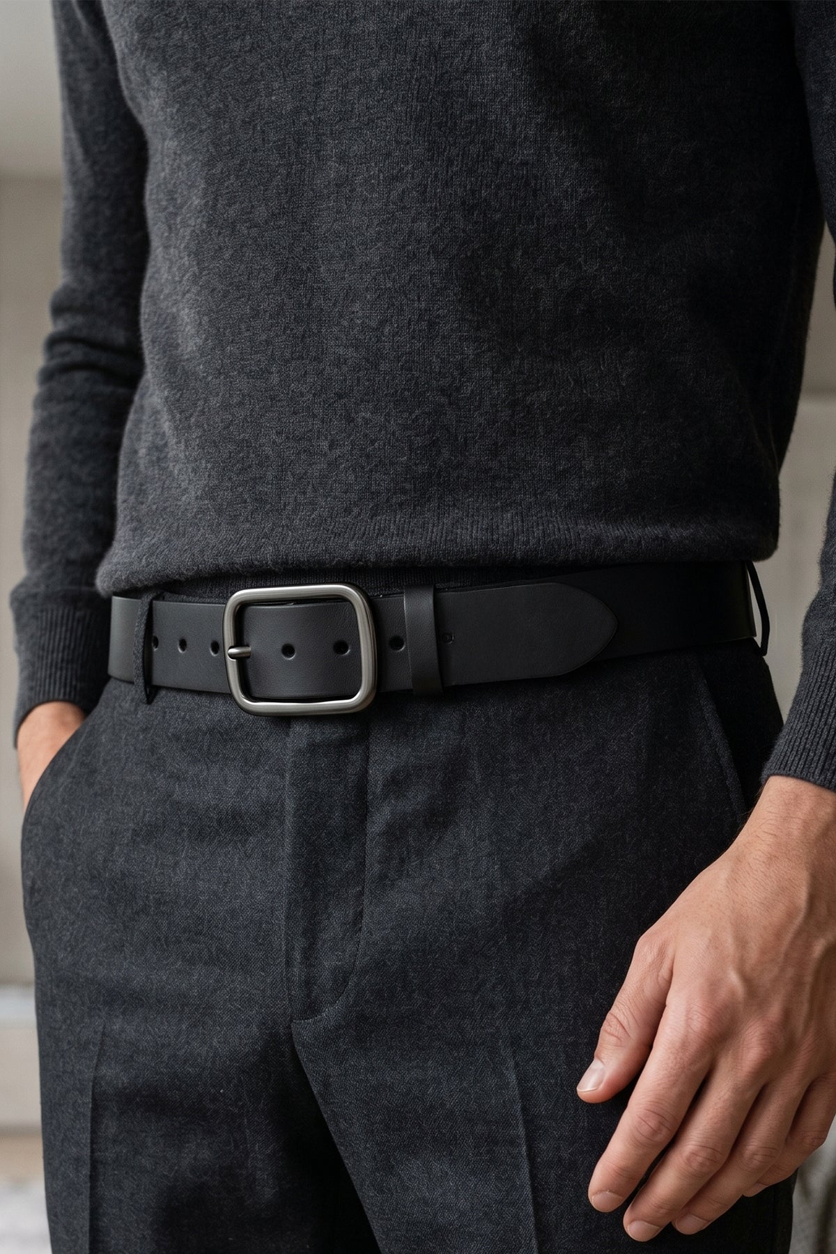 Man wearing Hunter Black leather men’s belt with a timeless pin buckle design, perfect for both casual and formal wear.