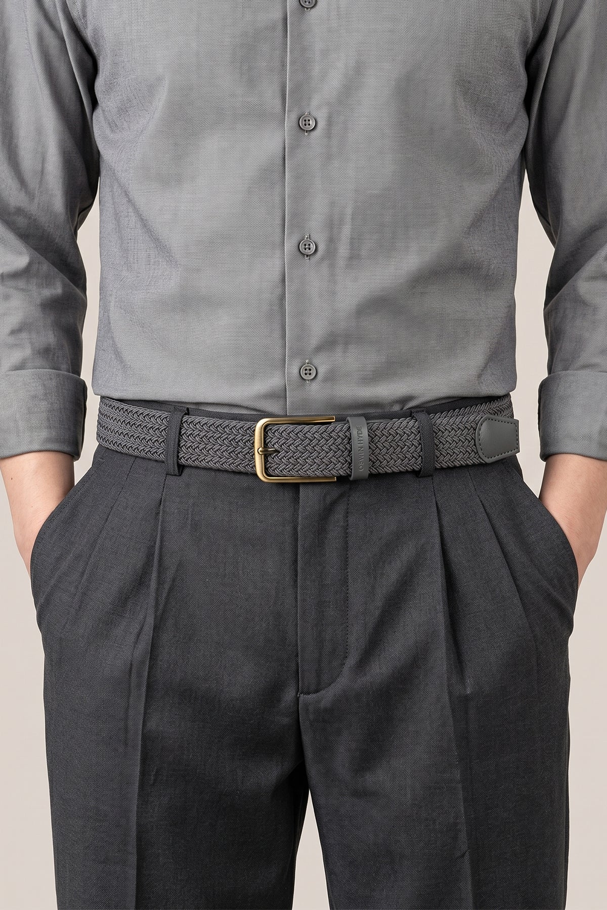 Model wearing Oswin Hyde Aron belt - Charcoal grey elastic webbing for formal and smart-casual outfits