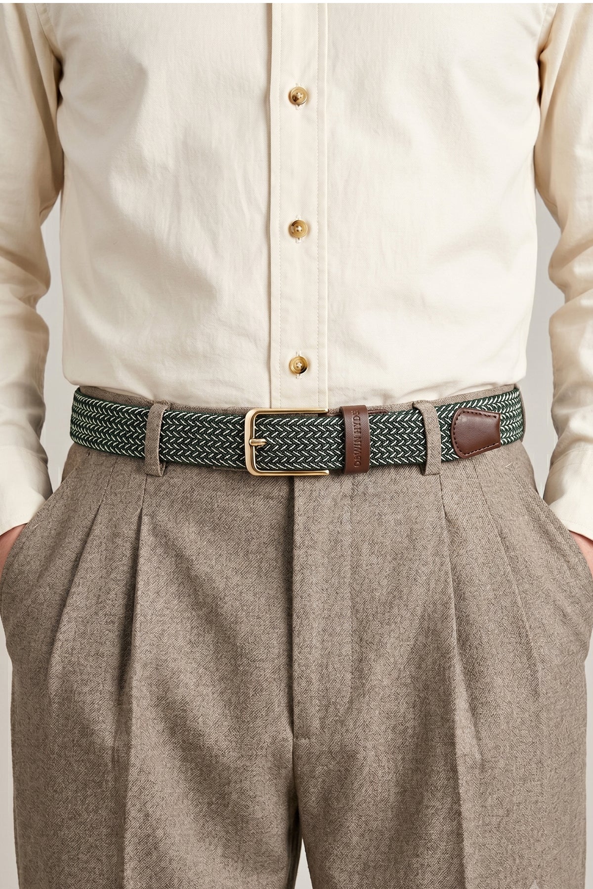 Man wearing Bert Green Elastic Belt for men with vibrant green woven webbing, ideal for weddings and casual everyday wear.Bert Green Elastic Belt for men with vibrant green woven webbing, ideal for weddings and casual everyday wear.